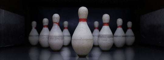 duckpin bowling pins set up in a triangle