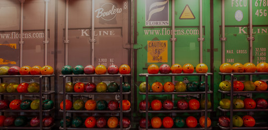 Shipping container wall with bowling balls