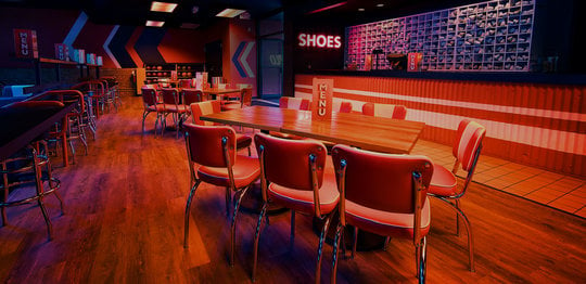 Dining area and shoe desk at Bowlero Wauwatosa