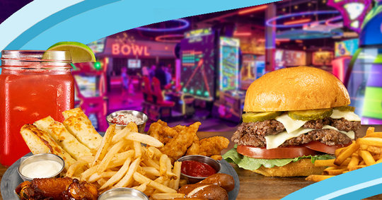 Hamburger, french fries, and chicken tenders in front of a bowling arcade center