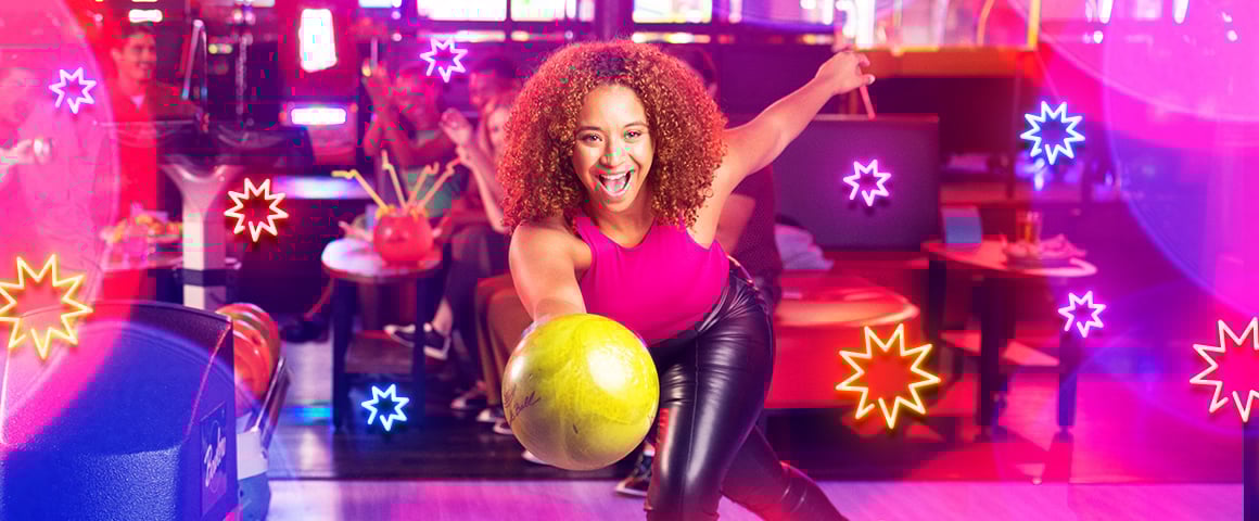 Woman bowling and smiling