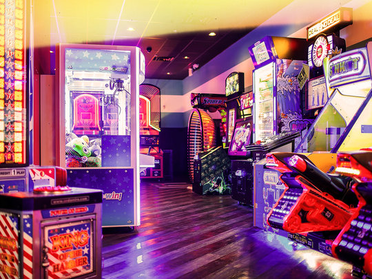 Arcade games with neon lighting