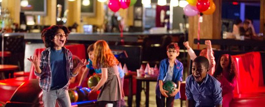 Kids having fun bowling