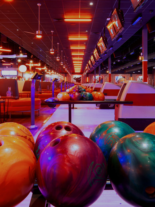 bowling balls with lanes in background