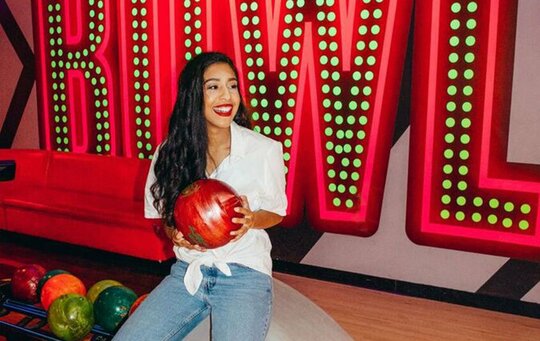 girl holding bowling ball