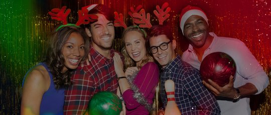 Holiday image with people smiling with holiday attire on