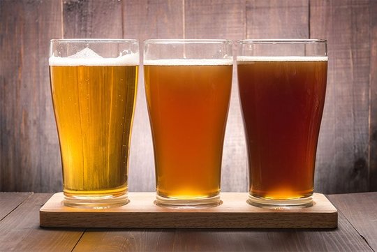 Three pint glasses of beer