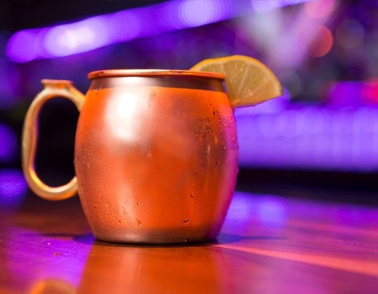 Moscow mule with a lemon wedge in it