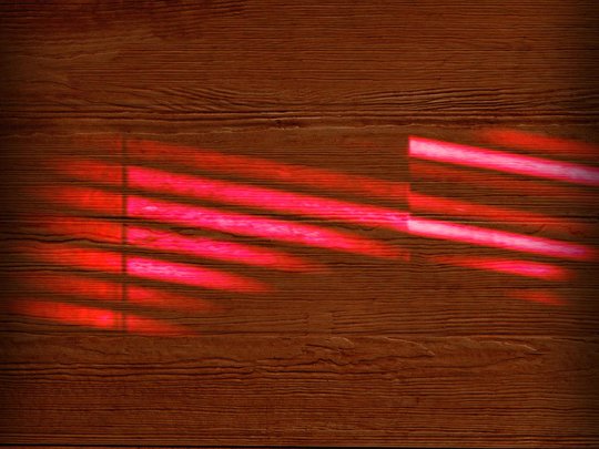 wood background with red streaks