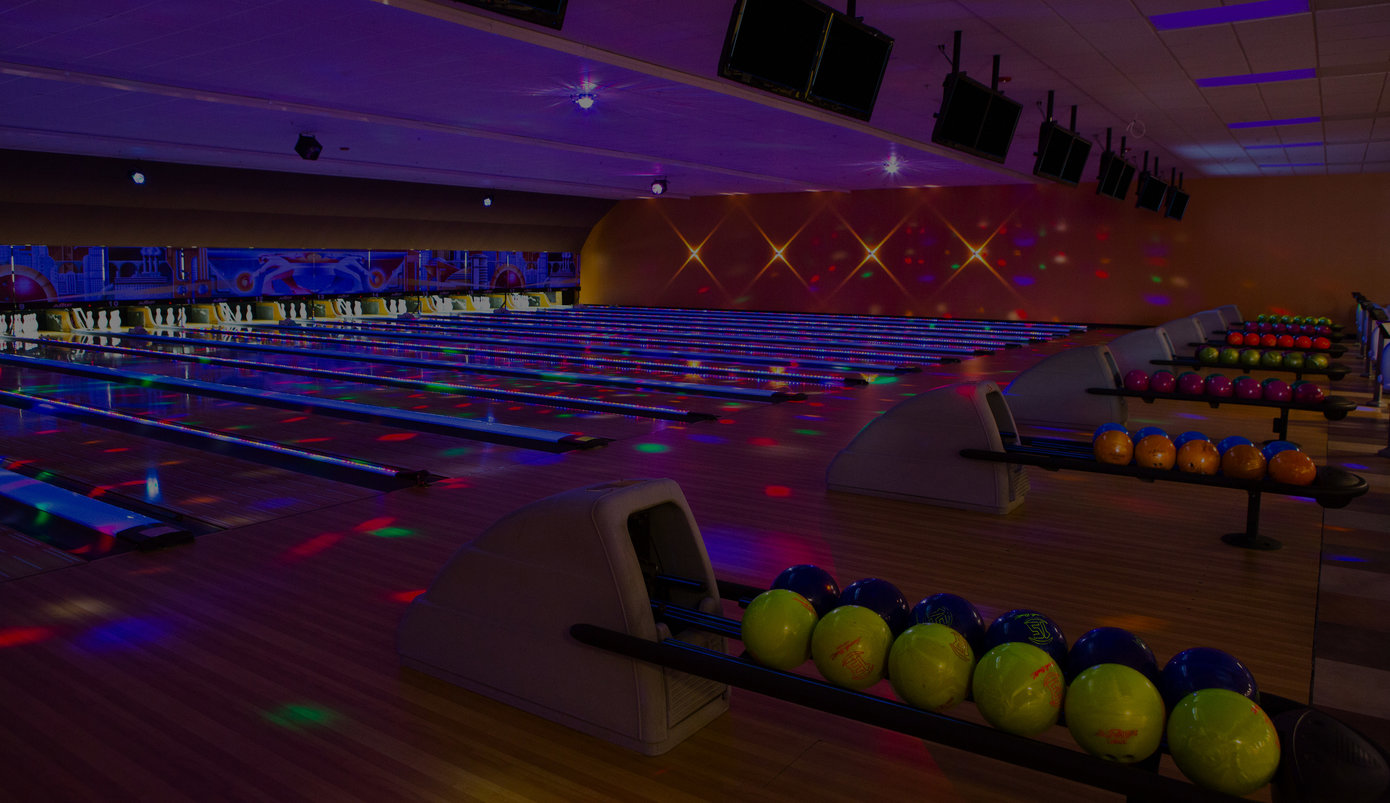 Dark photograph of a bowling alley